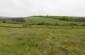 Mass grave of about thirty Jews near Verejeni, shot by Romanians in summer 1941. In 1941 the site was a natural ravine. Today, it’s an empty field. There is no memorial at the mass grave site. © Victoria Bahr - Yahad-In Unum