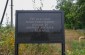 Memorial plaque with the inscription: "Here, on July 24, 1941, more than 30 civilians from the village of Kozhanka were shot".    ©Les Kasyanov/Yahad – In Unum