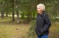 Ilga R., born in 1937,  accompanies the Yahad team to the location of the mass grave where the camp's Soviet POWs were shot and buried. The site is located on the edge of the city in a small forest.    ©Jordi Lagoutte/Yahad – In Unum