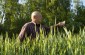 Vyacheslav points out the location of the Jewish mass graves located in the middle of the field. ©Jethro Massey/Yahad - In Unum