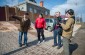 Yahad team with Anatoliy B. near the place where 10 Jews were burned alive by the Germans. © Kate Kornberg/Yahad-In Unum