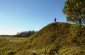 Edvardas stands on a hill next to the mass grave of Jewish children in Medžiokalnis © Kate Kornberg/Yahad - In Unum