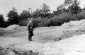 Possibly a member of the German Order Police near the mass grave at Gurka Polonka (Execution site close to the sugar factory, not far away from Horodyshche and Polonka). The photograph was taken shortly after the murder operation. © Yad Vashem Photo Colle