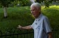 Viktor Sh., born in 1927, standing near the location of the former Executive Committee building, where Jews were detained for a short period before being marched on. ©Svitlana Kovaliova/Yahad - In Unum