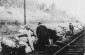 German officials examine the pile of abandoned luggage left on the platform after the departure of a deportation train  on its way to the Belzec death camp.©Photo Archive in public domain